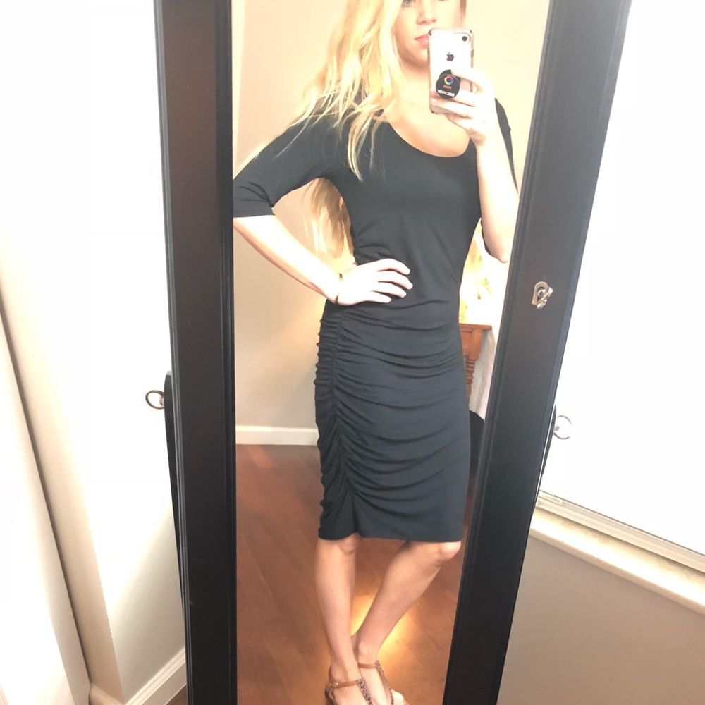 Black midi dress with side ruching.